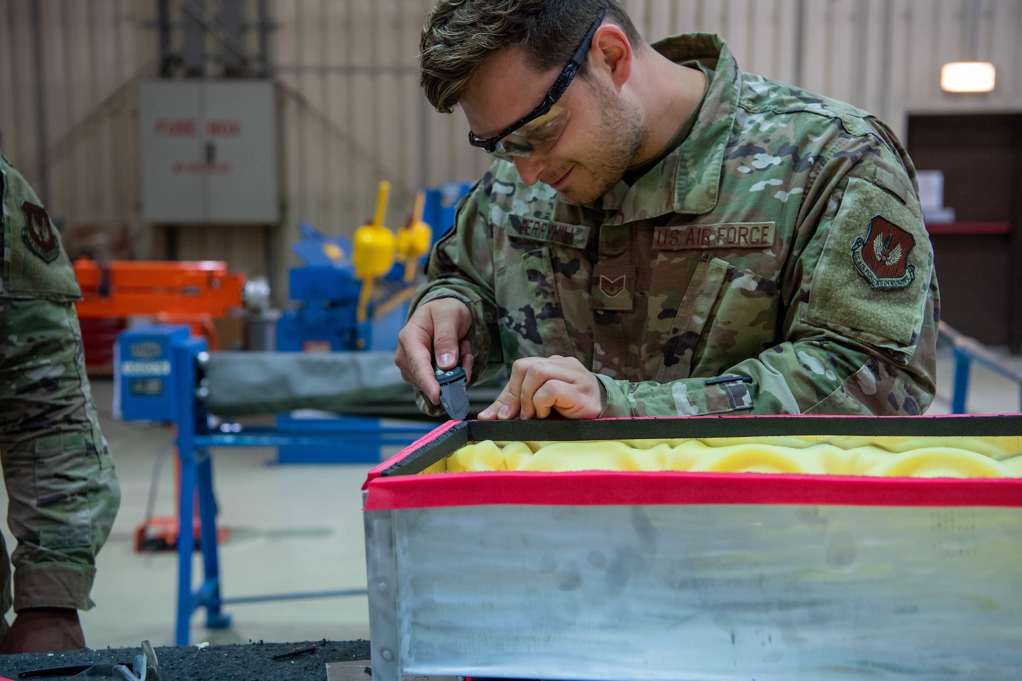 Airmen build pods.