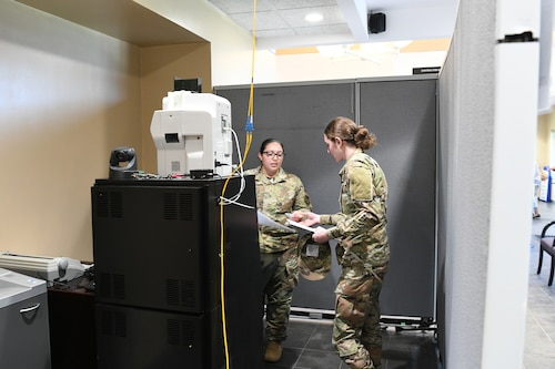 Two Airmen talking