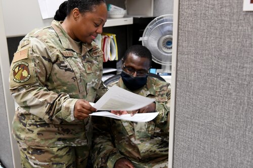 Two Airmen talking