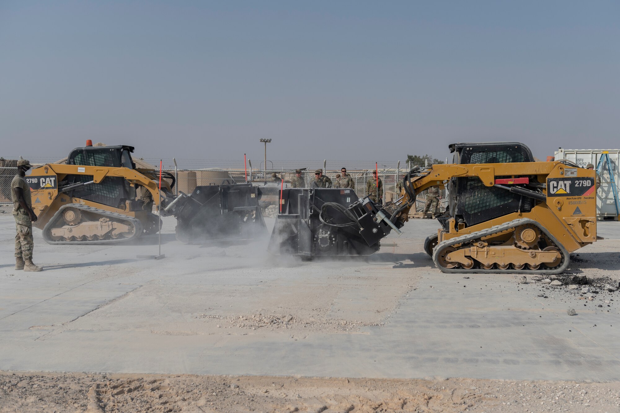 Airmen with the 332nd Expeditionary Civil Engineer Squadron repair concrete during an exercise Aug. 27, 2021, in an undisclosed location somewhere in Southwest Asia. The exercise tested how quickly 332nd ECES Airmen could restore potential damage to the airfield. (U.S. Air Force photo by Senior Airman Cameron Otte)