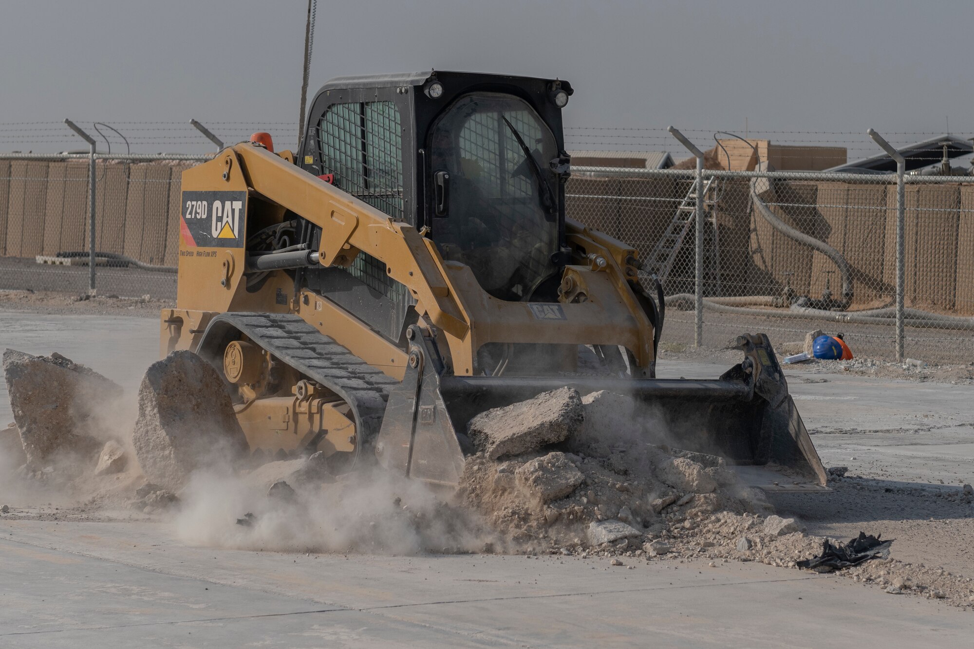 Airmen with the 332nd Expeditionary Civil Engineer Squadron repair concrete during an exercise Aug. 27, 2021, in an undisclosed location somewhere in Southwest Asia. The exercise tested how quickly 332nd ECES Airmen could restore potential damage to the airfield. (U.S. Air Force photo by Senior Airman Cameron Otte)