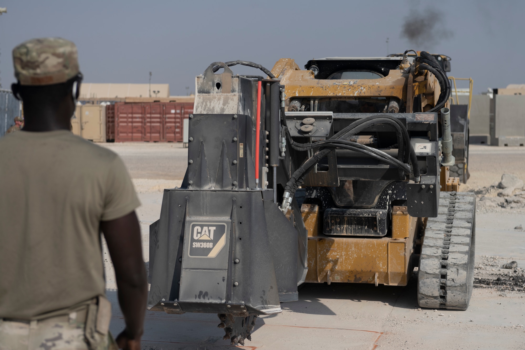 Airmen with the 332nd Expeditionary Civil Engineer Squadron repair concrete during an exercise Aug. 27, 2021, in an undisclosed location somewhere in Southwest Asia. The exercise tested how quickly 332nd ECES Airmen could restore potential damage to the airfield. (U.S. Air Force photo by Senior Airman Cameron Otte)