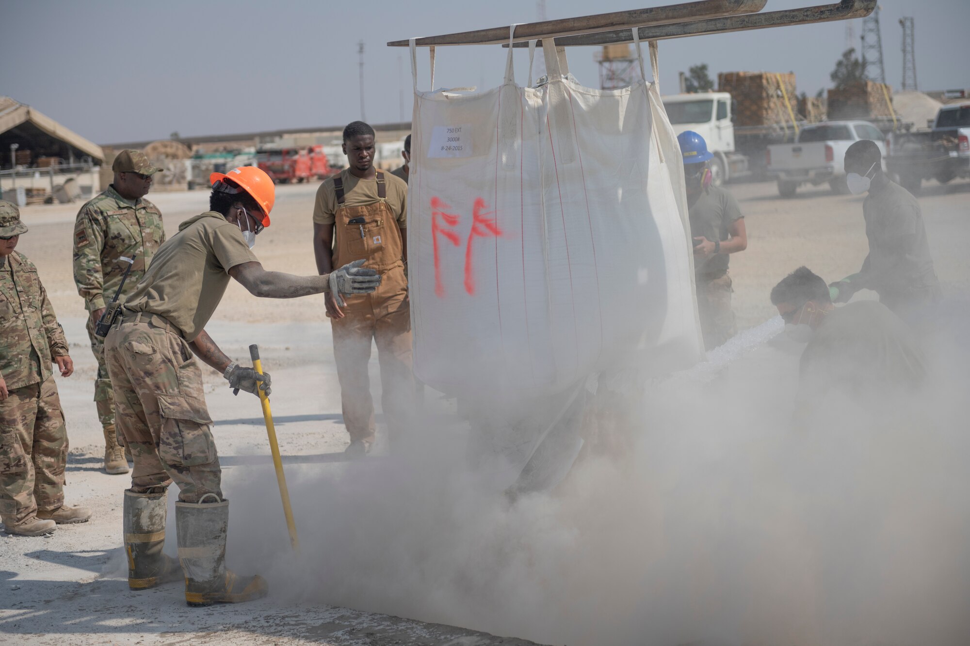 Airmen with the 332nd Expeditionary Civil Engineer Squadron repair concrete during an exercise Aug. 27, 2021, in an undisclosed location somewhere in Southwest Asia. The exercise tested how quickly 332nd ECES Airmen could restore potential damage to the airfield. (U.S. Air Force photo by Senior Airman Cameron Otte)