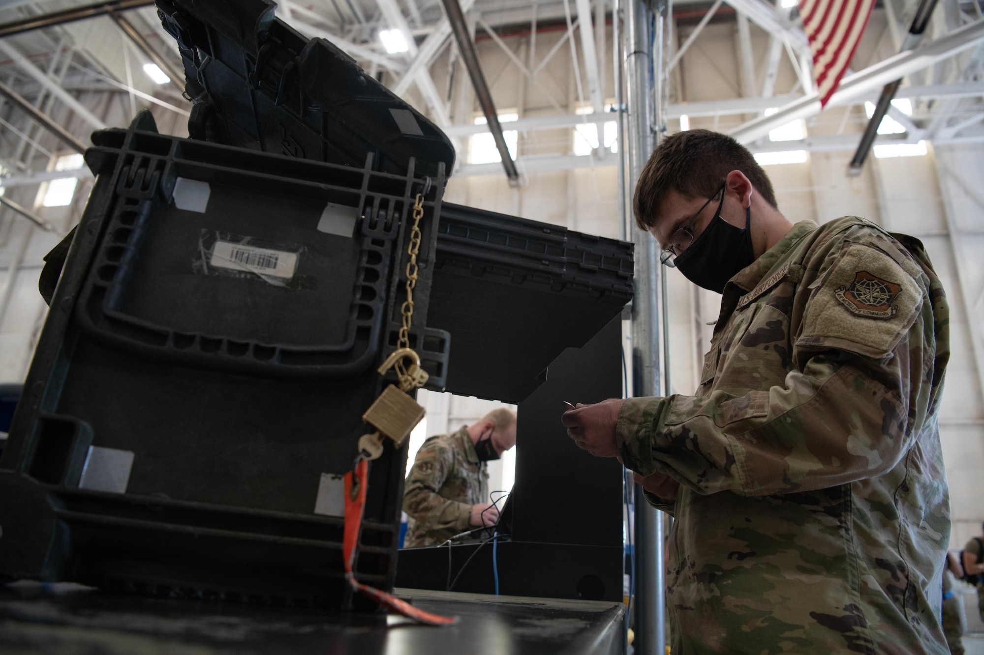 Airman 1st Class Victor Fix, 22nd Aircraft Maintenance Squadron support flight journeyman, inspects a toolkit during checkout Aug. 24, 2021, at McConnell Air Force Base, Kansas. Three additional checkout counters were included in the redesign of the consolidated tool kit and are expected to reduce checkout times by 50 percent per customer. (U.S. Air Force photo by Senior Airman Marc Garcia)