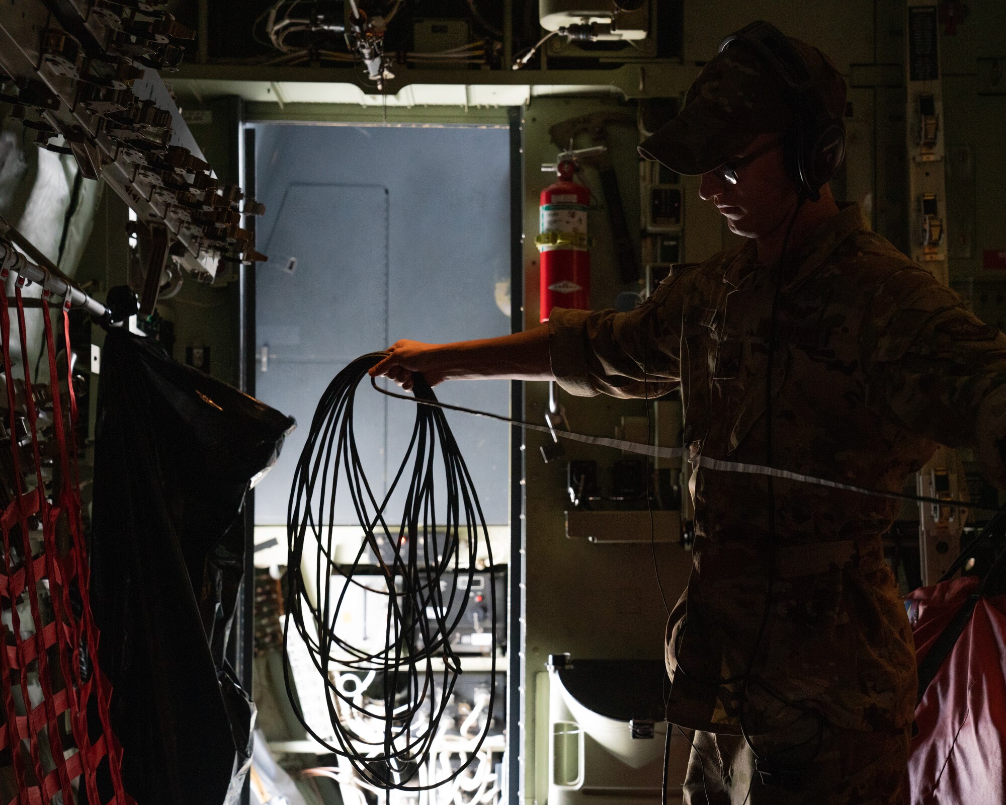 U.S. Air Force Staff Sgt. Nolan Brandt, a 39th Airlift Squadron C-130J Super Hercules instructor loadmaster from Dyess Air Force Base, Texas, prepares for takeoff during RED FLAG-Alaska 21-3.