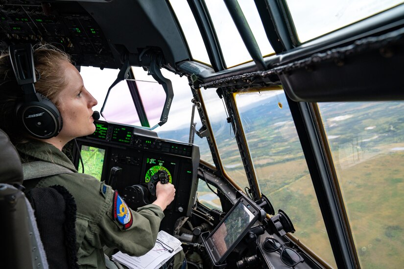 U.S. Air Force 1st Lt. Emily Nole, a 39th Airlift Squadron C-130J super Hercules pilot from Dyess Air Force Base, Texas, views out of the windshield as she flies during a RED FLAG-Alaska 21-3 sortie.