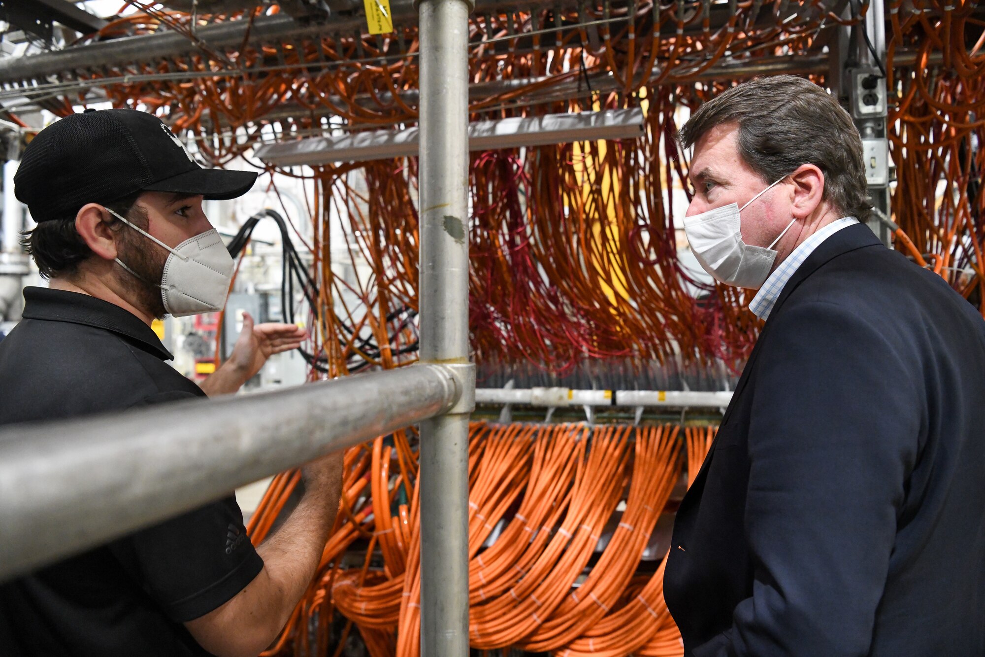 From left, John Hile, an Arnold Engineering Development Complex (AEDC) test engineer, explains how an arc heater works to Sen. Bill Hagerty of Tennessee during a visit by the senator to the headquarters of AEDC, Arnold Air Force Base, Tenn., Aug. 23, 2021. Arc heaters allow for the testing of thermal protection systems in simulated environments representative of hypersonic flight. (U.S. Air Force photo by Jill Pickett)