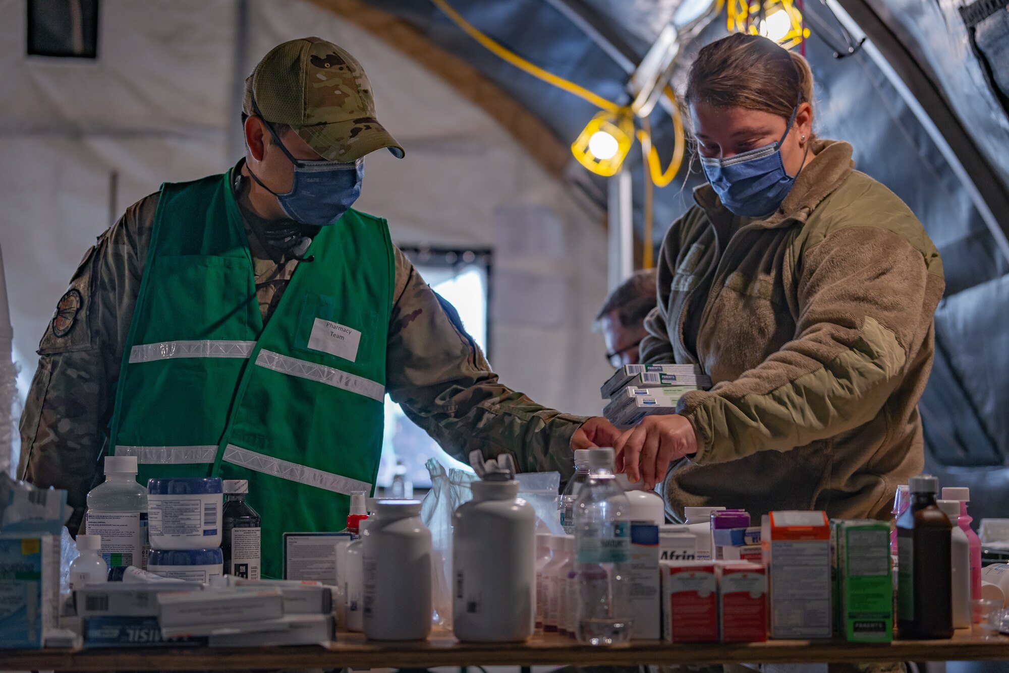 Airmen prepare medical care for evacuees.