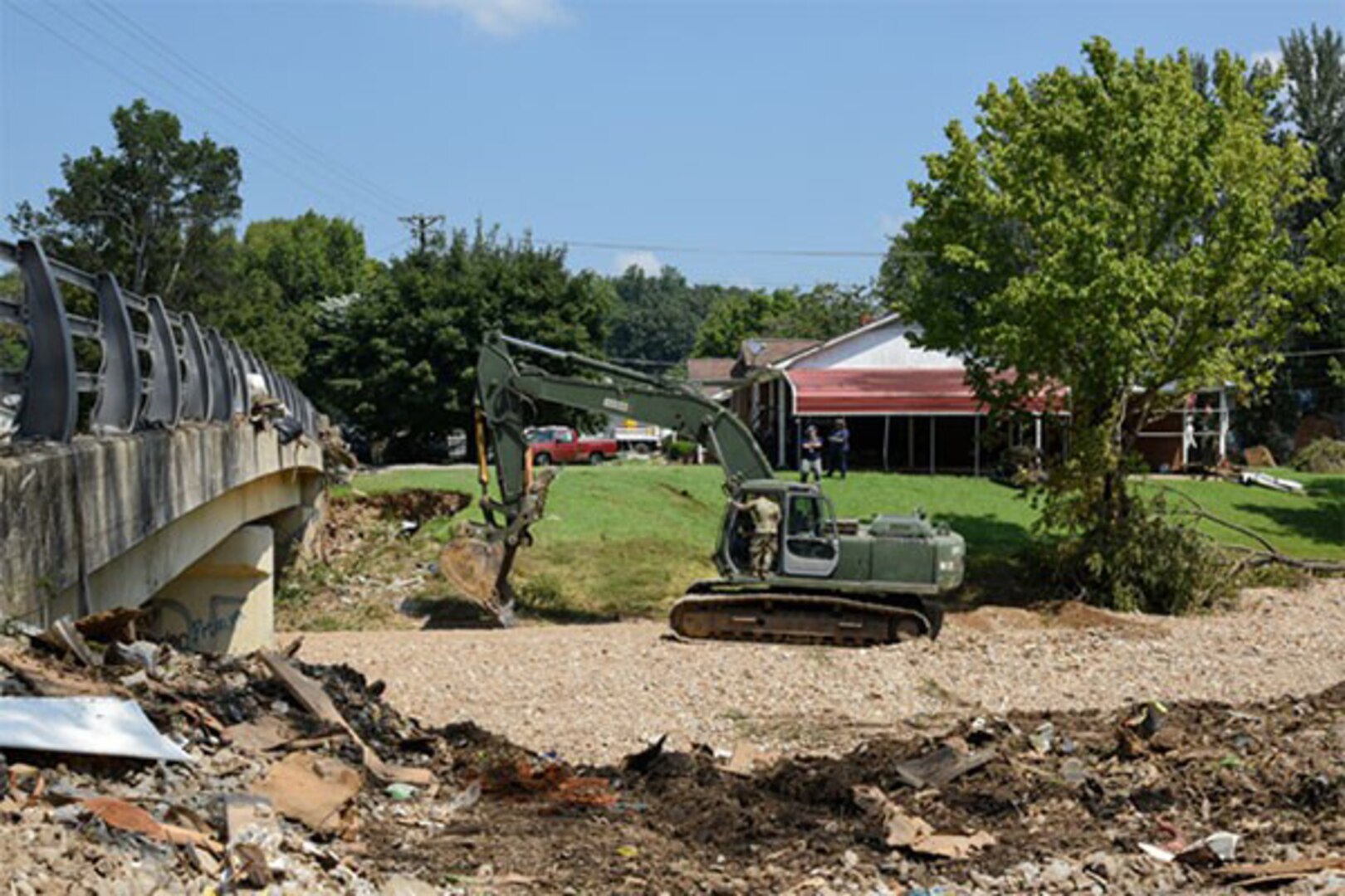 Soldiers and Airmen from the Tennessee National Guard conduct cleanup operations in Waverly Aug. 26, 2021, following deadly flooding. More than 80 members of the Tennessee National Guard were working with state and local emergency personnel in the affected area.