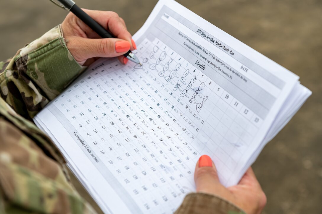 A photo of an Airmen holding a paper