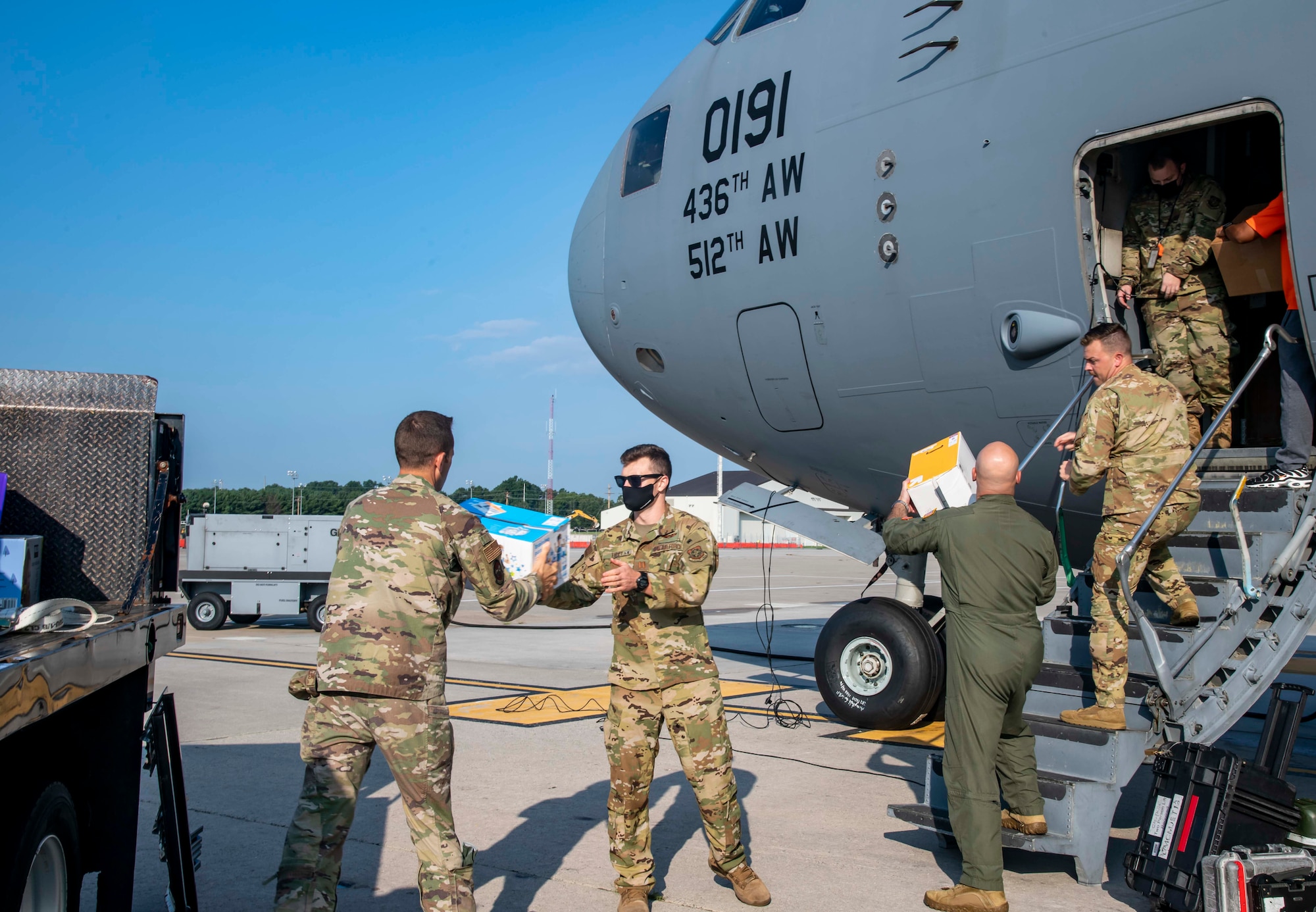 Dover Air Force Base Airmen load supplies en route to support Afghanistan evacuations onto a C-17 Globemaster III at Dover AFB, Delaware, Aug. 24, 2021. Team Dover members donated infant formula, blankets and clothing in support of the safe evacuation of U.S. citizens, Special Immigrant Visa applicants and other vulnerable Afghans. (U.S. Air Force photo by Senior Airman Stephani Barge)