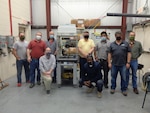 IMAGE: Engineers from Naval Surface Warfare Center Dahlgren Division (NSWCDD) and Naval Surface Warfare Center Philadelphia Division (NSWCPD) support electrical and thermal laser characterization testing. From left to right, back to front, Chris Heflin of NSWCDD, TJ McKelvey of NSWCPD, Robert Mancini of NSWCPD, Brian Rees of NSWCPD, Charles Nelatury of NSWCPD, Jonathan Schrier of NSWCPD and Michael Richardson of NSWCDD are pictured. In the front row, from left to right, Eric Thompson and Alain Mbateng of NSWCDD are pictured. (U.S. Navy Photo/Released)