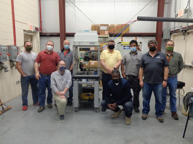 IMAGE: Engineers from Naval Surface Warfare Center Dahlgren Division (NSWCDD) and Naval Surface Warfare Center Philadelphia Division (NSWCPD) support electrical and thermal laser characterization testing. From left to right, back to front, Chris Heflin of NSWCDD, TJ McKelvey of NSWCPD, Robert Mancini of NSWCPD, Brian Rees of NSWCPD, Charles Nelatury of NSWCPD, Jonathan Schrier of NSWCPD and Michael Richardson of NSWCDD are pictured. In the front row, from left to right, Eric Thompson and Alain Mbateng of NSWCDD are pictured. (U.S. Navy Photo/Released)