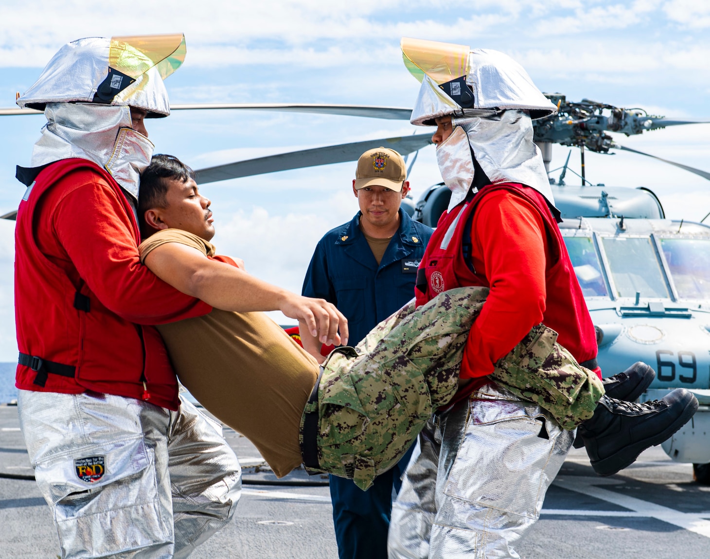 Sailors participate in an aircraft firefighting and medical training exercise aboard the Independence-variant littoral combat ship USS Tulsa (LCS 16), Aug. 27, 2021.