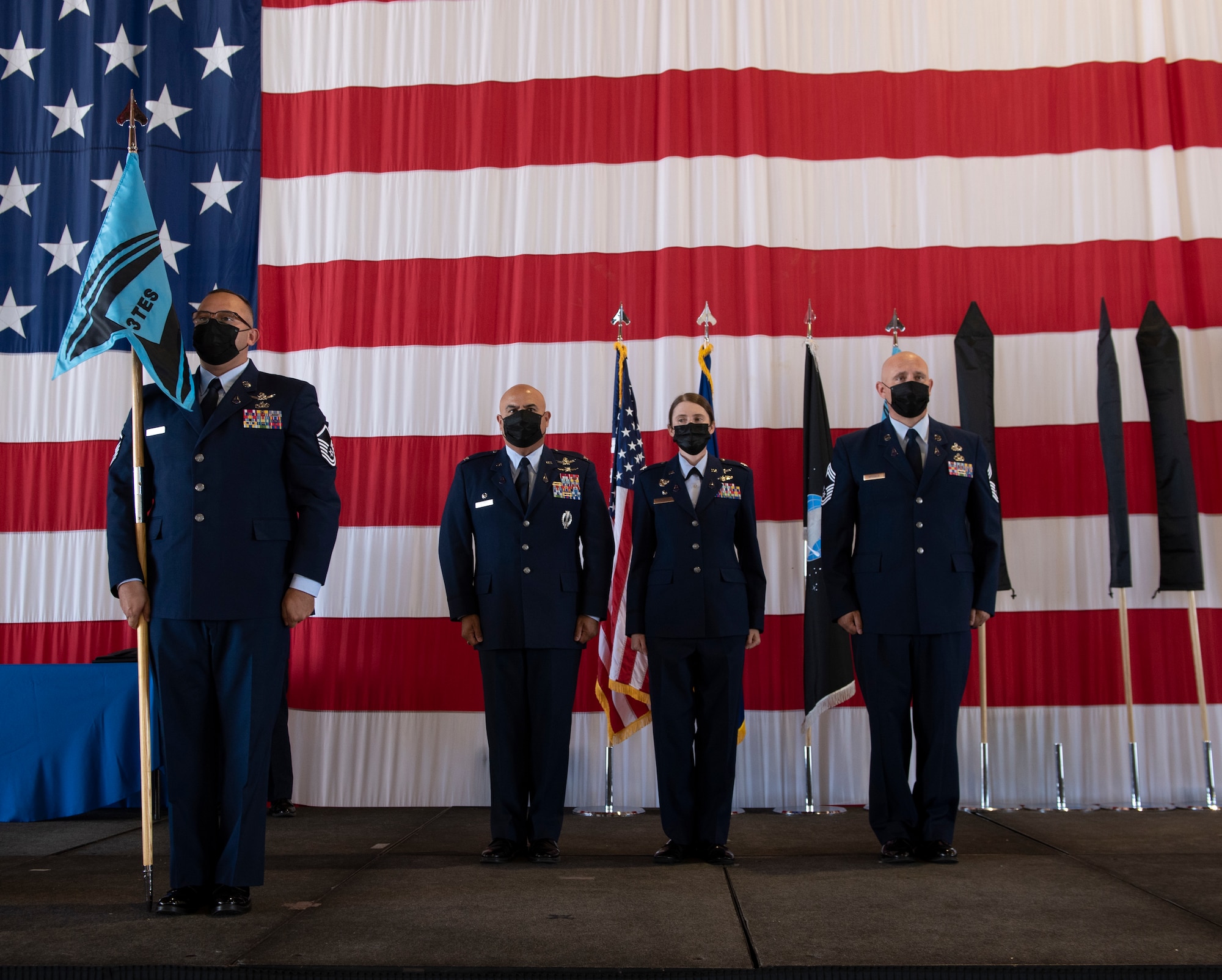 Service members stand at attention during ceremony