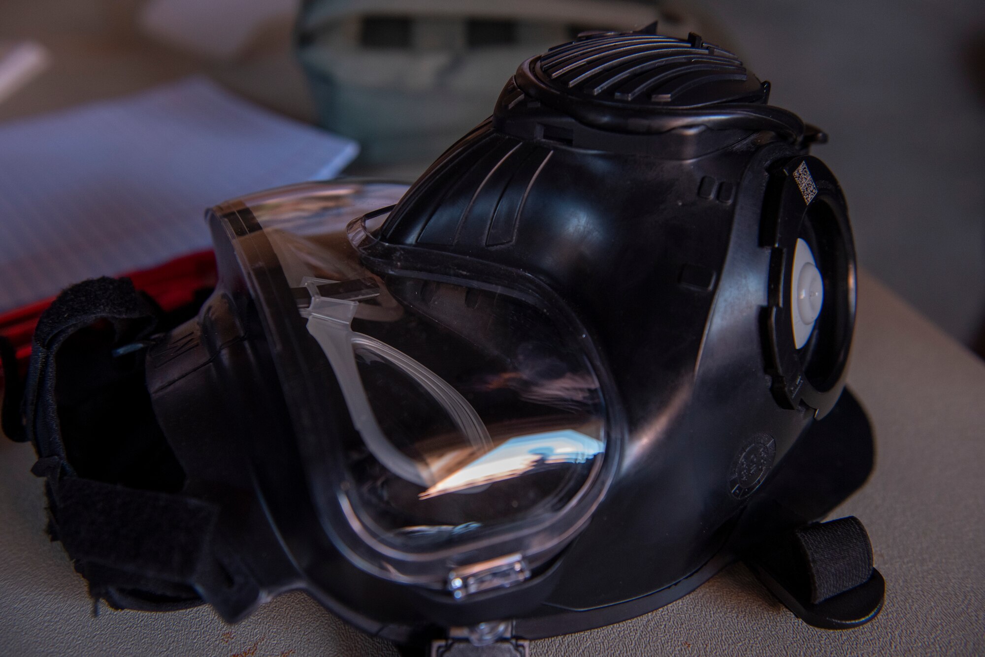 Participants from the Peterson-Schriever Garrison wore Mission Oriented Protective Posture (MOPP) gear during the chemical, biological, radiological and nuclear defense exercise at Camp Red Devil on Fort Carson, Colorado, Aug. 18, 2021. The M50 joint service general purpose gas mask is worn to prevent against CBRN threats and is currently being fielded to all of the U.S. military branches. (U.S. Space Force photo by Airman 1st Class Kaitlin Castillo)