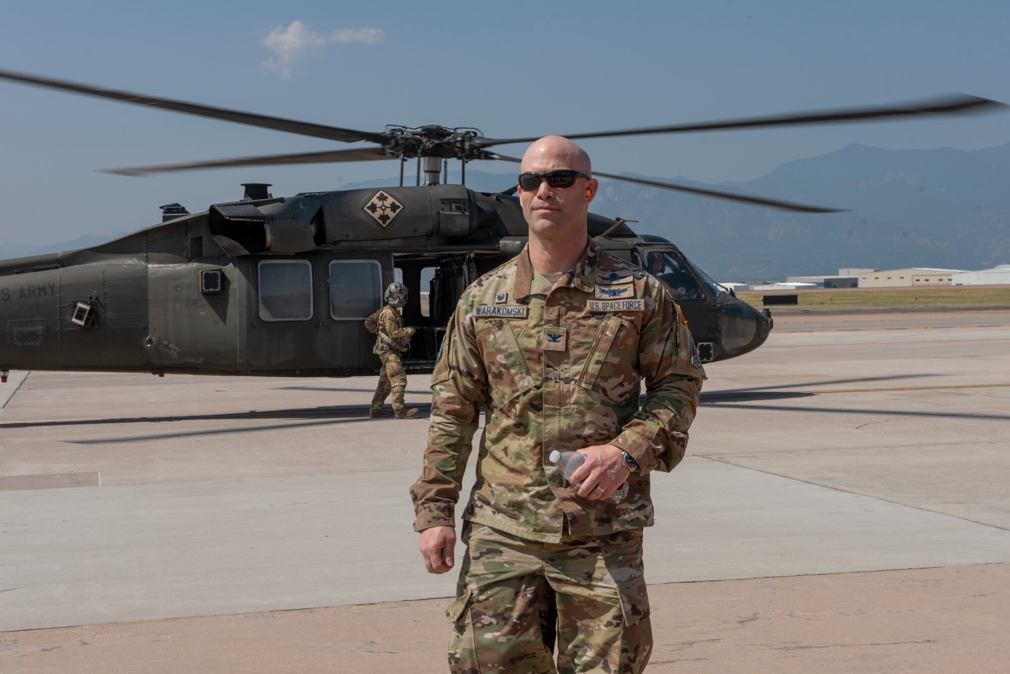 U.S. Space Force Col. Shay Warakomski, Peterson-Schriever Garrison commander, lands at Peterson Space Force Base, Colorado after visiting with the Airmen and Guardians participating in the chemical, biological, radiological and nuclear defense exercise at Camp Red Devil on Fort Carson, Colorado Aug. 18, 2021. Forty-two Airmen and Guardians from the P-S GAR participated in the day long exercise. (U.S. Space Force photo by Airman 1st Class Kaitlin Castillo)
