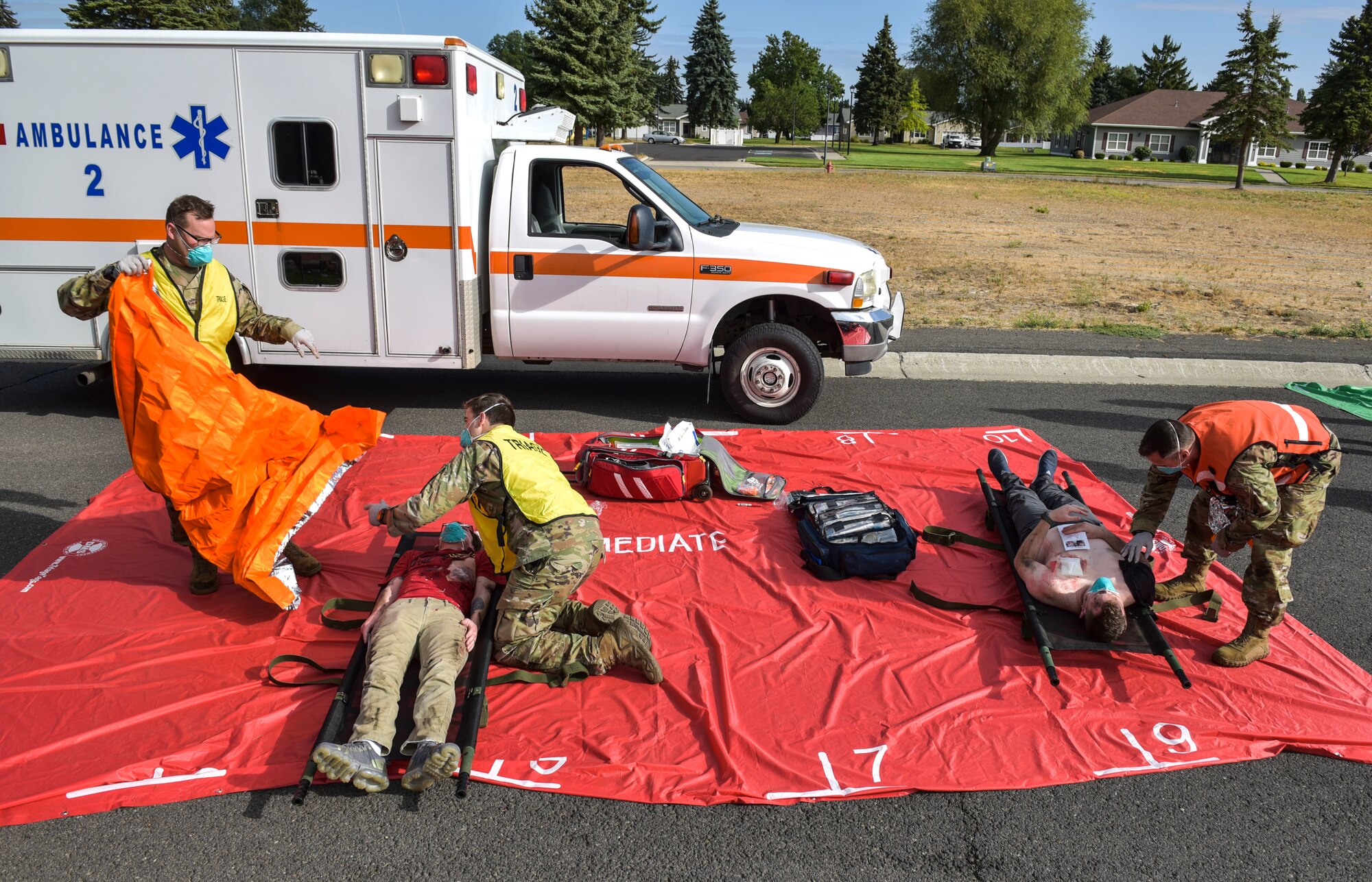 Members of the 92nd Medical Group treat simulated patients during Exercise Ready Eagle at Fairchild Air Force Base, Washington, Aug. 27, 2021.