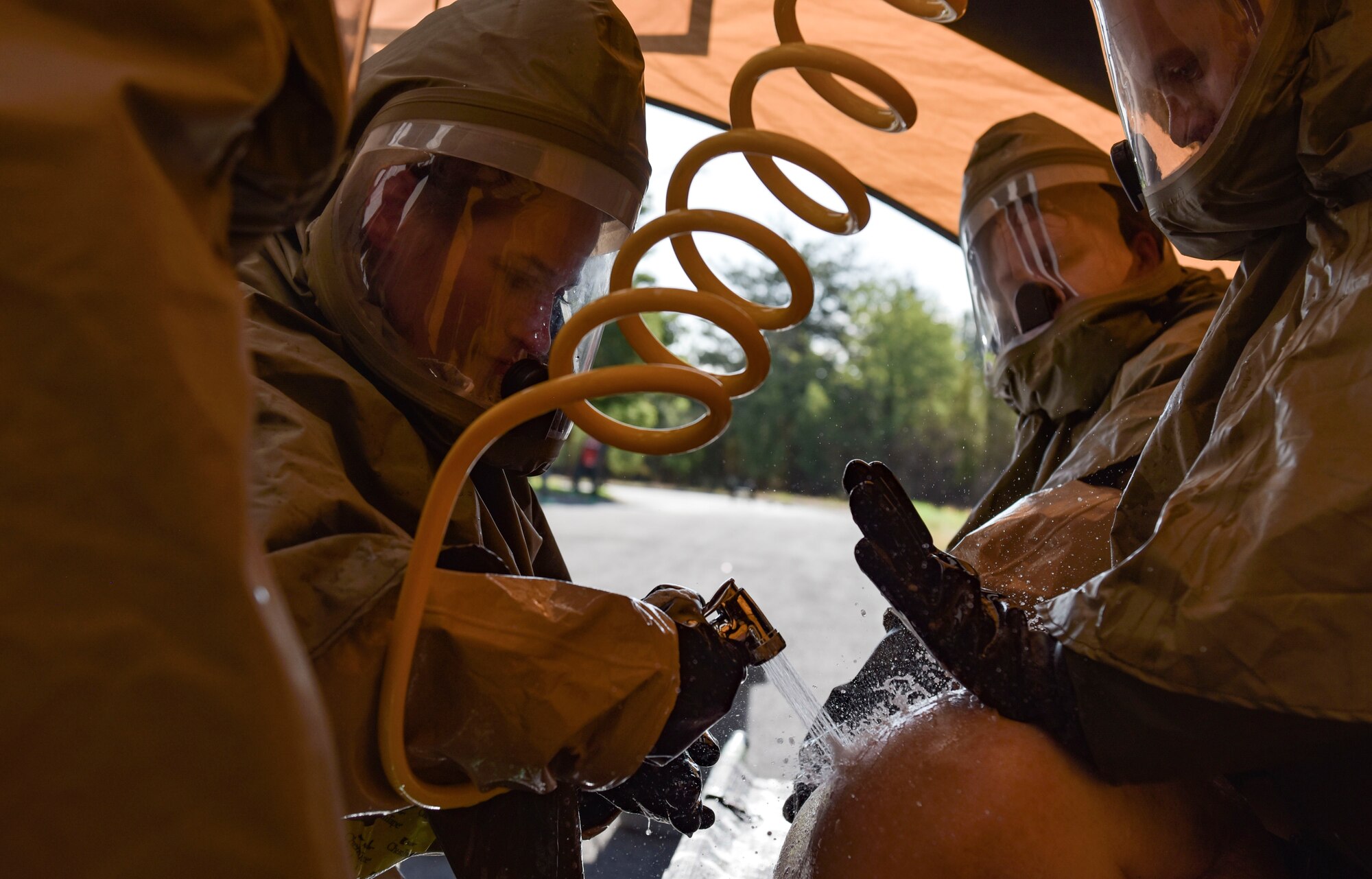 Members of the 92nd Medical Group perform decontamination procedures on a simulated patient during Exercise Ready Eagle at Fairchild Air Force Base, Washington, Aug. 27, 2021.
