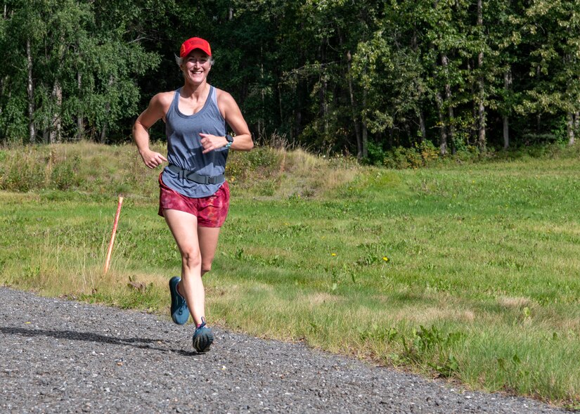 A runner completes a portion of the race during a Women’s Equality Day 5K at Joint Base Elmendorf-Richardson, Alaska, Aug. 26, 2021. JBER hosted events across the installation to celebrate women in the military community. (U.S. Air Force photo by Senior Airman Emily Farnsworth)