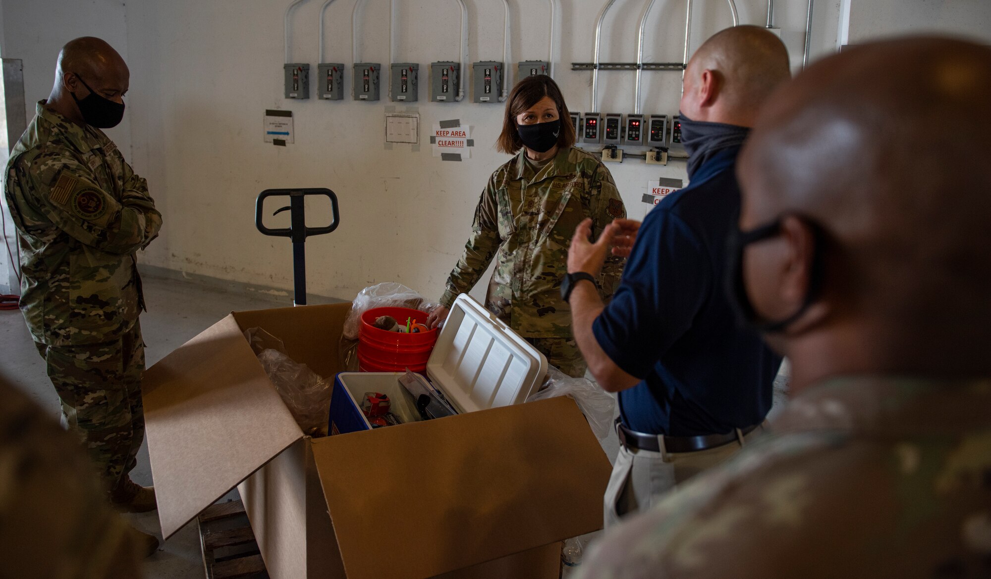 Chief Master Sergeant of the Air Force JoAnne S. Bass speaks with Airmen assigned to the 734th Air Mobility Squadron and the 44th Aerial Port Squadron about Operation Christmas Drop at Andersen Air Force Base, Guam, Aug. 27, 2021.