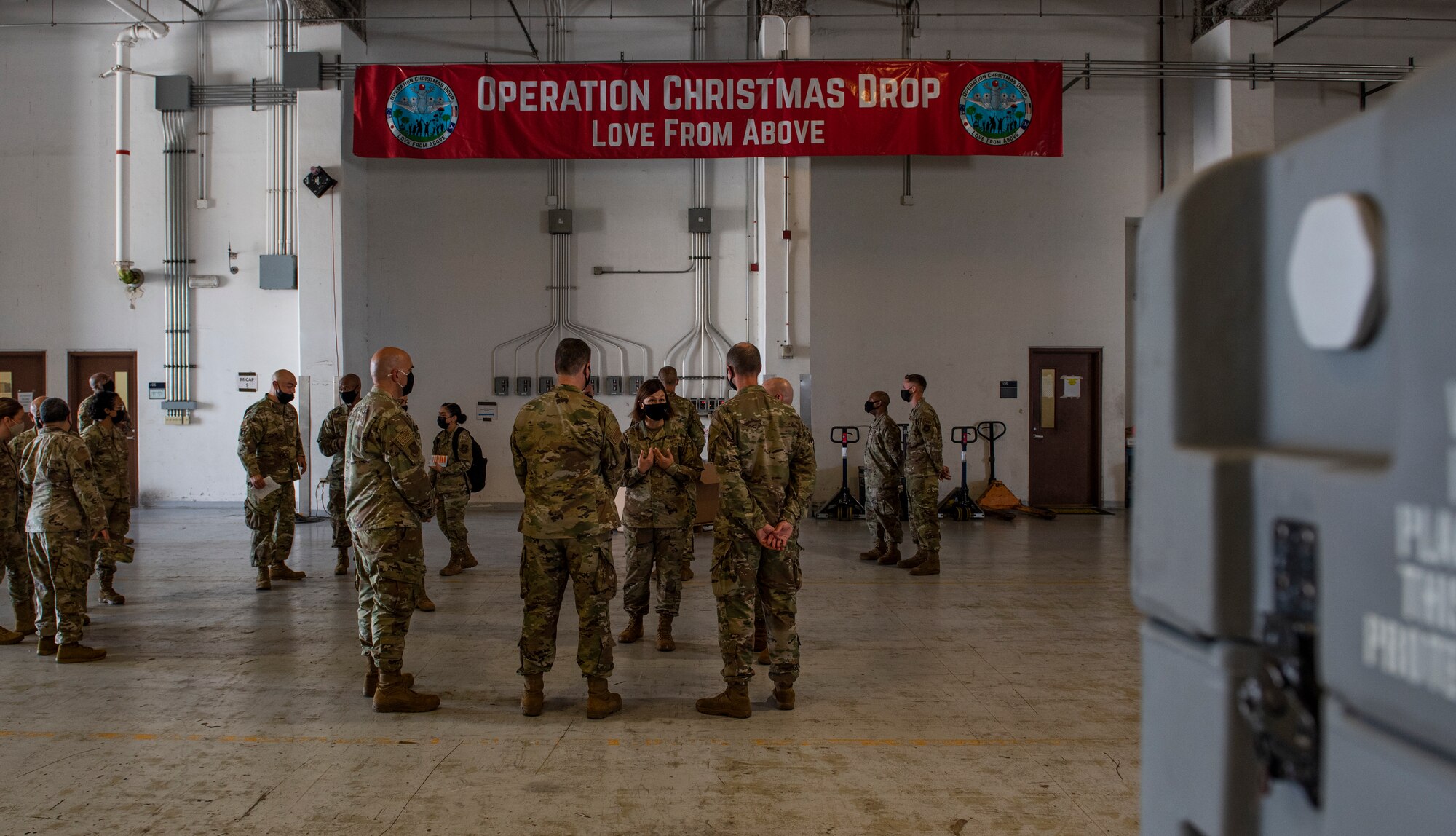 Chief Master Sergeant of the Air Force JoAnne S. Bass speaks with Airmen assigned to the 734th Air Mobility Squadron and the 44th Aerial Port Squadron about Operation Christmas Drop at Andersen Air Force Base, Guam, Aug. 27, 2021.