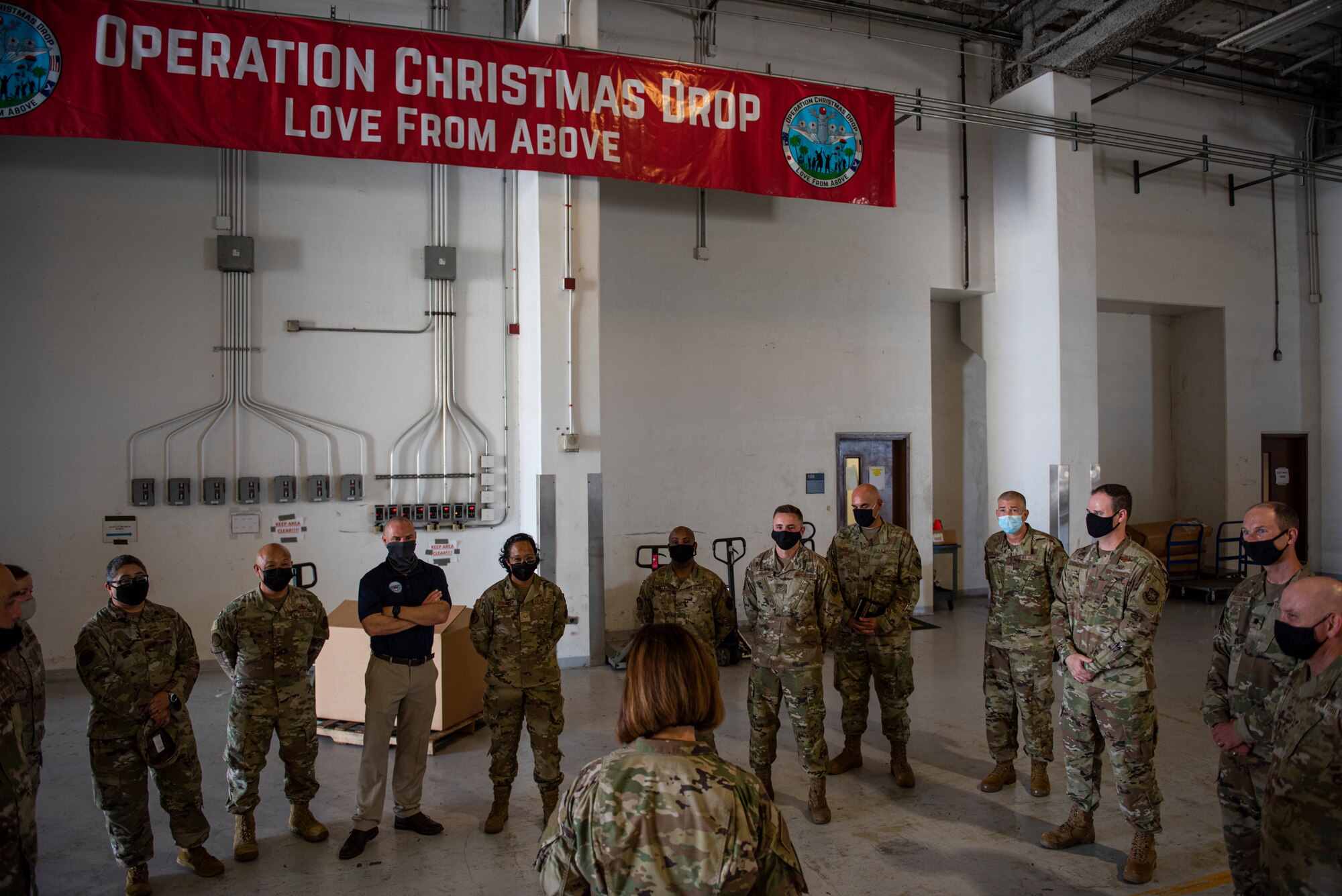 Chief Master Sergeant of the Air Force JoAnne S. Bass speaks with Airmen assigned to the 734th Air Mobility Squadron and the 44th Aerial Port Squadron about Operation Christmas Drop at Andersen Air Force Base, Guam, Aug. 27, 2021.