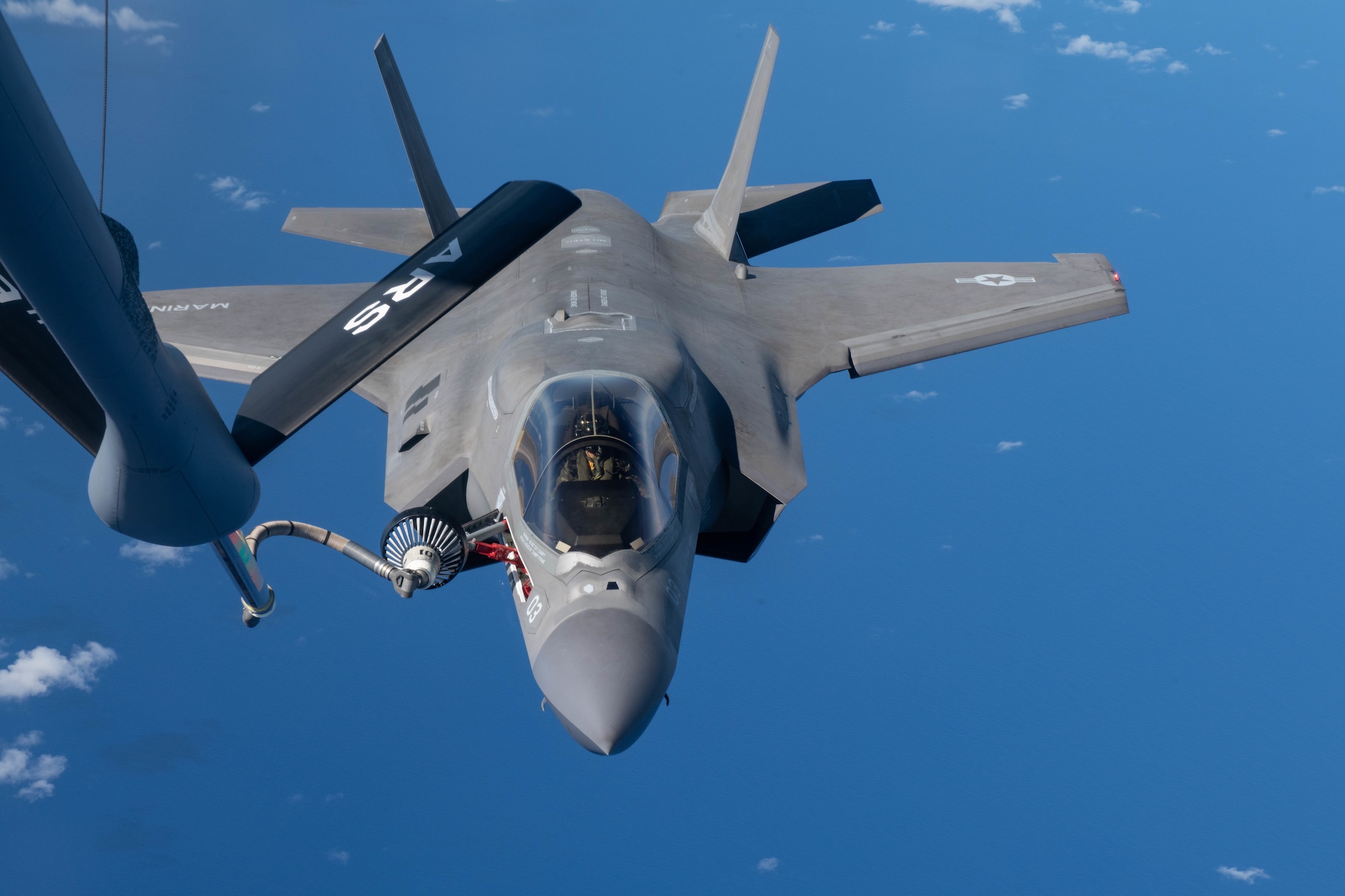 A U.S. Marine Attack Squadron 211 F-35B Lightning II, assigned to the United Kingdom Carrier Strike Group, refuels from a KC-135 Stratotanker, assigned to the 909th Air Refueling Squadron, Kadena Air Base, Japan during a Large Scale Global Exercise 21 mission over the western Pacific Ocean, Aug. 24, 2021. Kadena Air Base participated in LSGE 21, which is a Department of Defense exercise conducted by U.S. Indo-Pacific Command. (U.S. Air Force photo by Staff Sgt. Kyle Johnson)