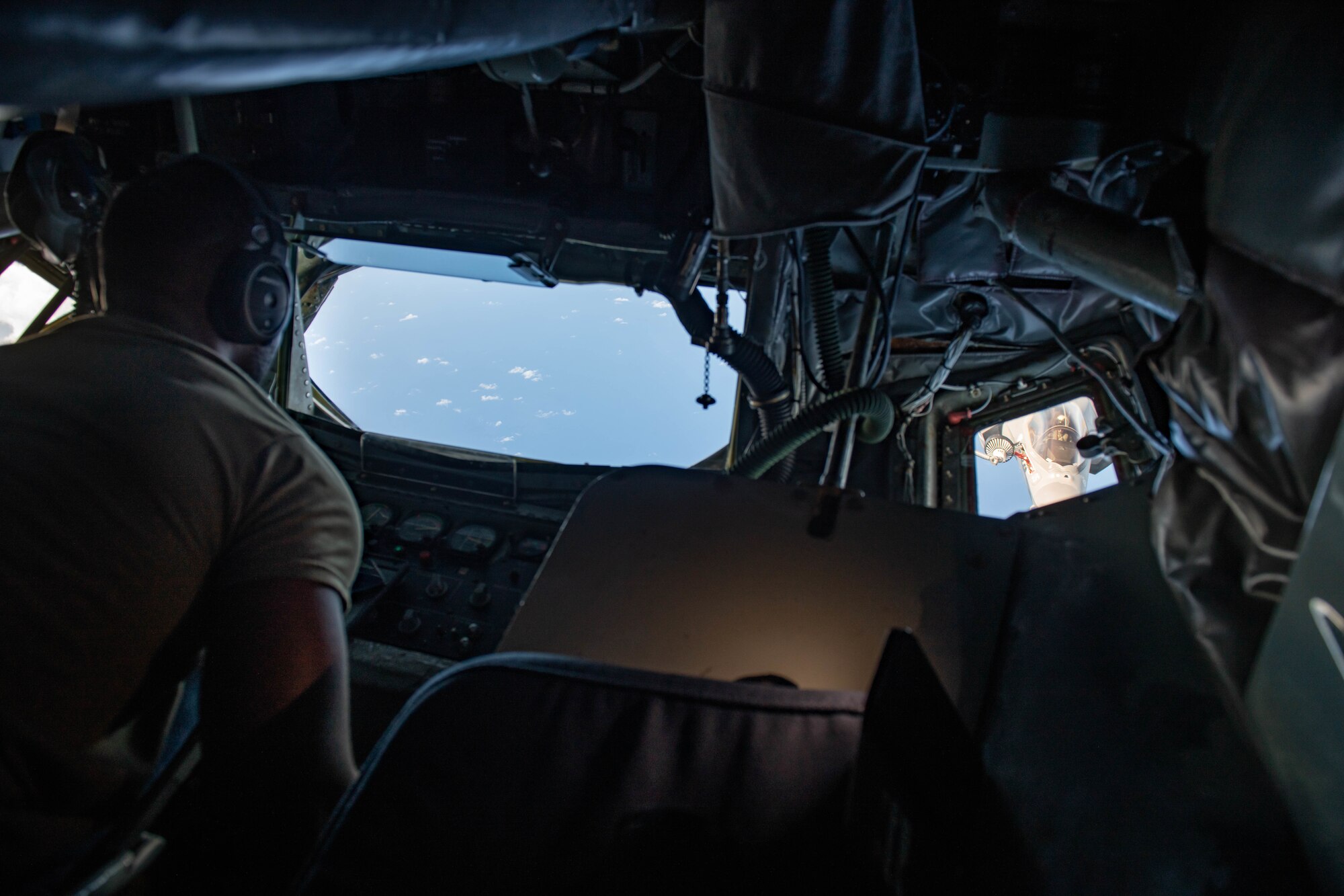 U.S. Air Force Staff Sgt. Reinaldo Brown, 909th Air Refueling Squadron boom operator, refuels a U.S. Marine Attack Squadron 211 F-35B Lightning II, assigned to the United Kingdom Carrier Strike Group, during a Large Scale Global Exercise 21 mission over the western Pacific Ocean, Aug. 24, 2021. The U.S. Joint Forces remains ready to respond to the full spectrum of conflict and disaster. (U.S. Air Force photo by Staff Sgt. Kyle Johnson)