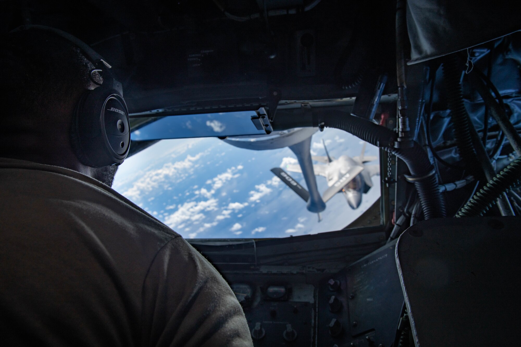 U.S. Air Force Staff Sgt. Reinaldo Brown, 909th Air Refueling Squadron boom operator, refuels a U.S. Marine Attack Squadron 211 F-35B Lightning II, assigned to the United Kingdom Carrier Strike Group, during a Large Scale Global Exercise 21 mission over the western Pacific Ocean Aug. 24, 2021. U.S. Joint Forces routinely operate across the region, maintaining the necessary readiness, flexibility and agility to respond to the changes in the operational environment. (U.S. Air Force photo by Staff Sgt. Kyle Johnson)