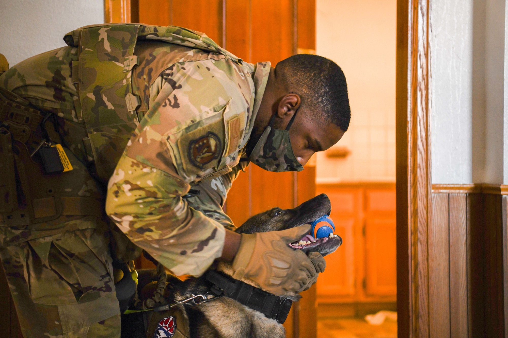 Staff Sgt. Trenton Clark, military working dog handler assigned to the 90th Security Forces Squadron, conducts certification with his MWD at F.E. Warren Air Force Base, Wyoming, Aug. 25, 2021. Certification is where a commander observes the handler and MWD identifying explosives through a simulated environment in order to certify that the team is capable of performing duties. The process is designed for the commander to instill trust in the MWD team. (U.S. Air Force photo by Airman 1st Class Charles Munoz)