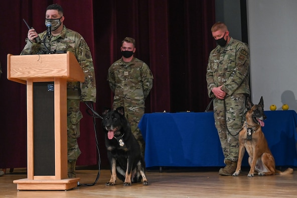 MWD Baxi is honored with a last call during a retirement ceremony at Kirtland Air Force Base.