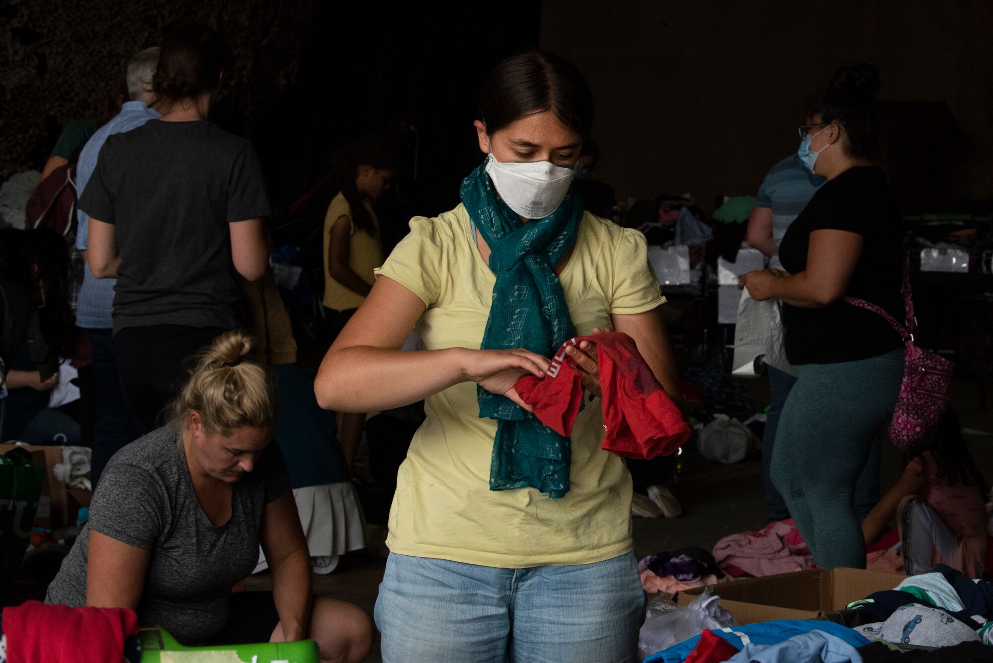 Volunteer sorts through donations.