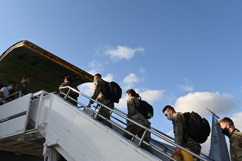 U.S. Air Force Airmen from the 48th Medical Group board a KC-135 Stratotanker at Royal Air Force Mildenhall, England, to deploy to Ramstein Air Base to support Operation Allies Refuge Aug. 23, 2021.