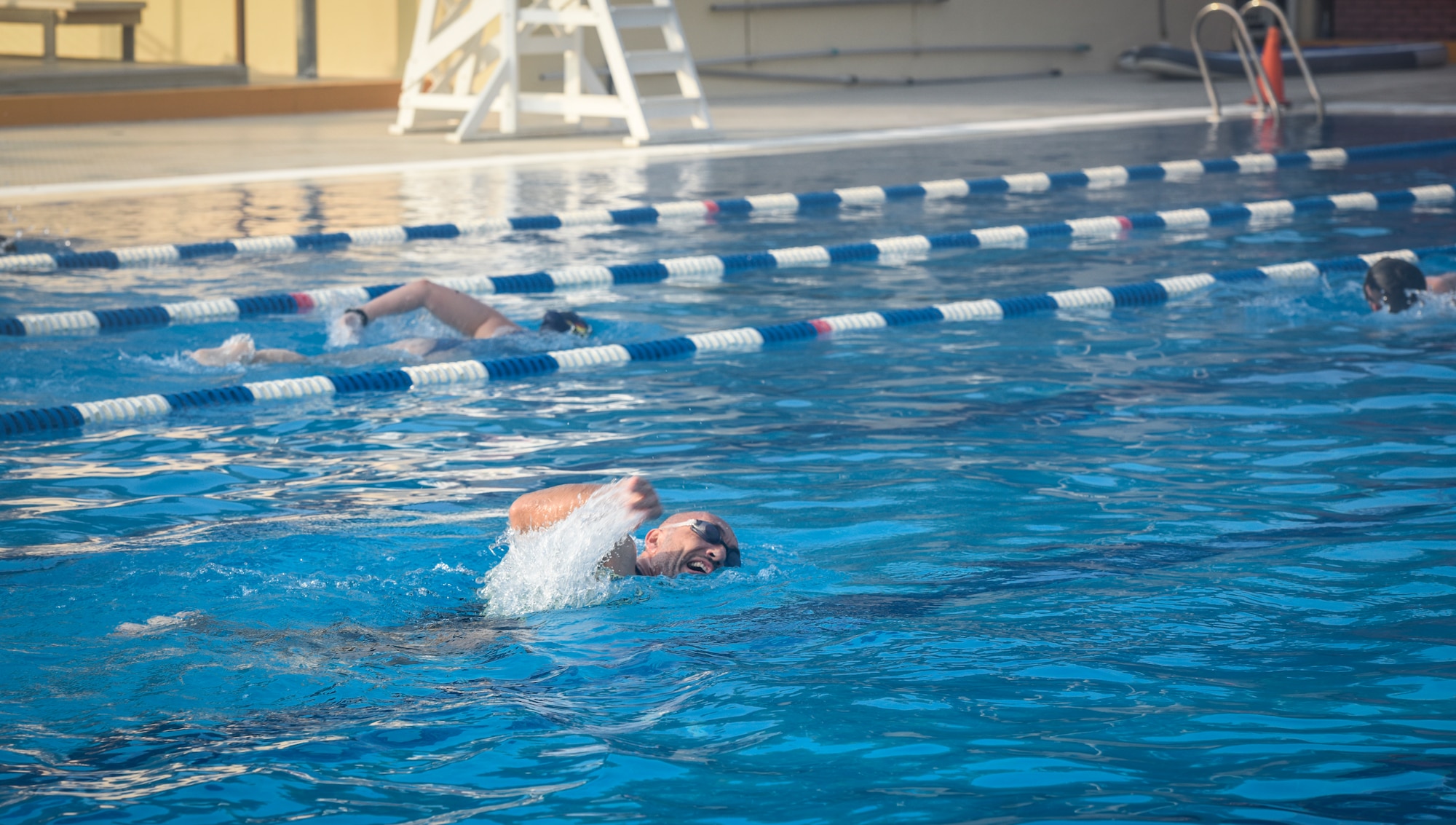 Athletes swimming during triathlon