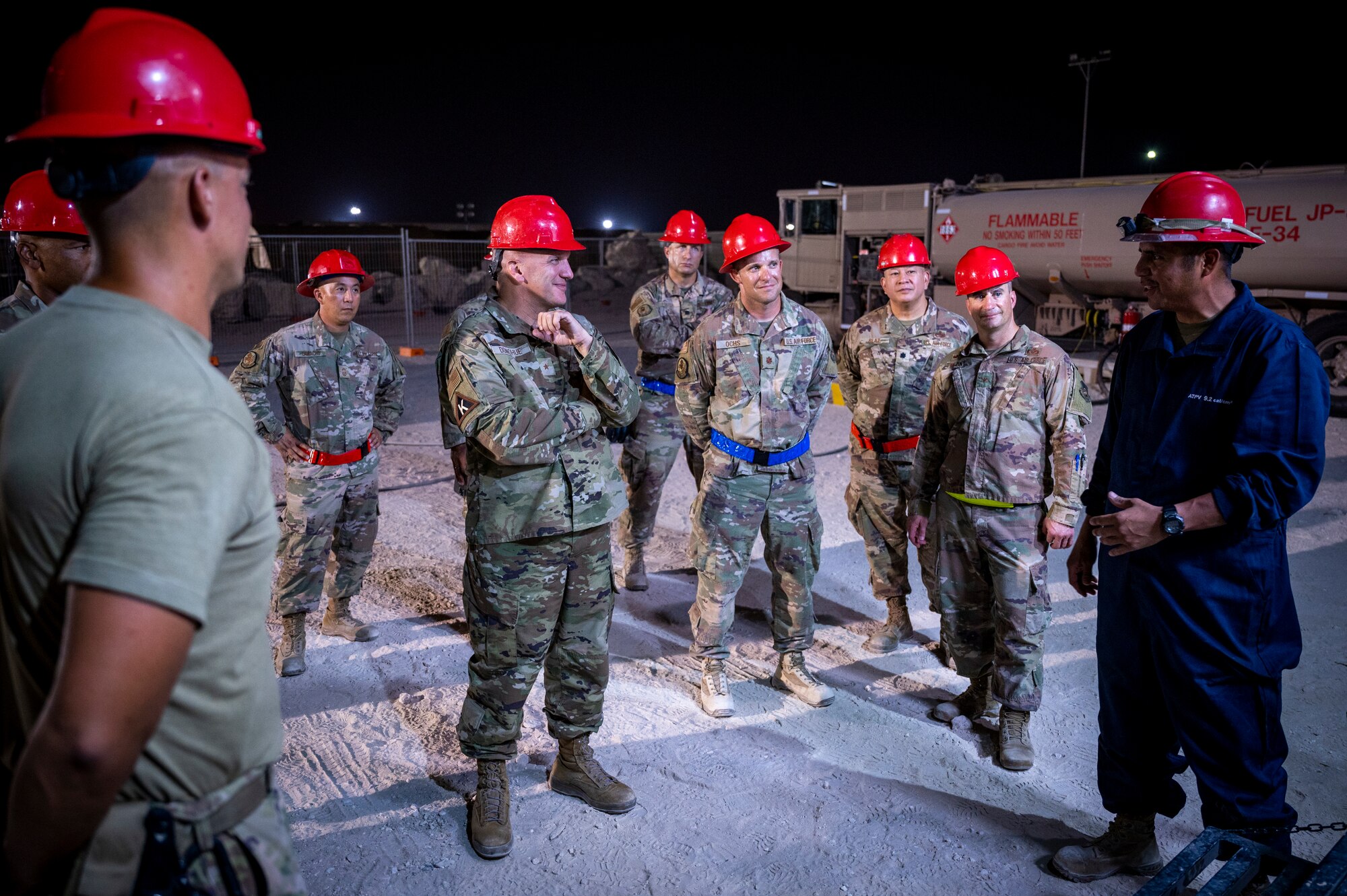 Brig. Gen. Gerald Donohue, 379th Air Expeditionary Wing commander, listens to a briefing on a recently installed powerplant Aug. 29, 2021, at Al Udeid Air Base, Qatar.