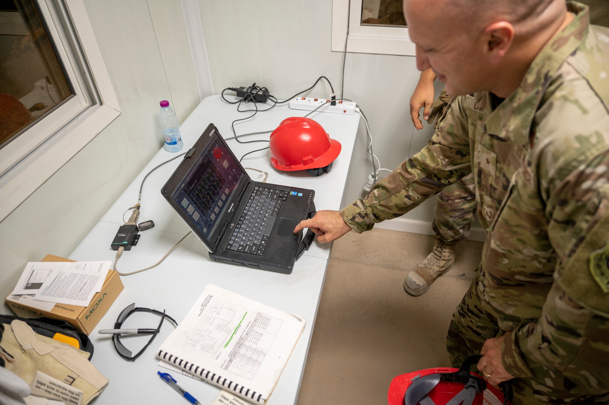 Brig. Gen. Gerald Donohue, 379th Air Expeditionary Wing commander, turns on the power to a newly installed powerplant Aug. 29, 2021, at Al Udeid Air Base, Qatar.