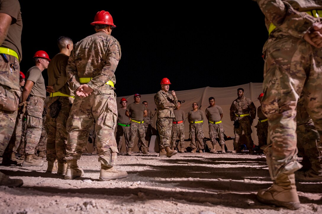 Brig. Gen. Gerald Donohue, 379th Air Expeditionary Wing commander, speaks to members of the 1st Expeditionary Civil Engineering Group Aug. 29, 2021, at Al Udeid Air Base, Qatar.