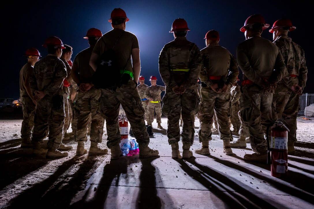 Col. Clifford Theony, 1st Expeditionary Civil Engineering Group commander, speaks to members of his team during a power up ceremony Aug. 29, 2021, at Al Udeid Air Base, Qatar.