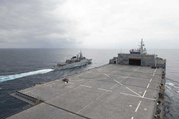 Brazilian Navy frigate Independencia executes a manuever on the port side of the Expeditionary Sea Base USS Hershel "Woody" Williams during manuevering drills, Aug. 22, 2021. Hershel "Woody" Williams is on a scheduled deployment in the U.S. Sixth Fleet area of operations in support of U.S. national interests and security in Europe and Africa.