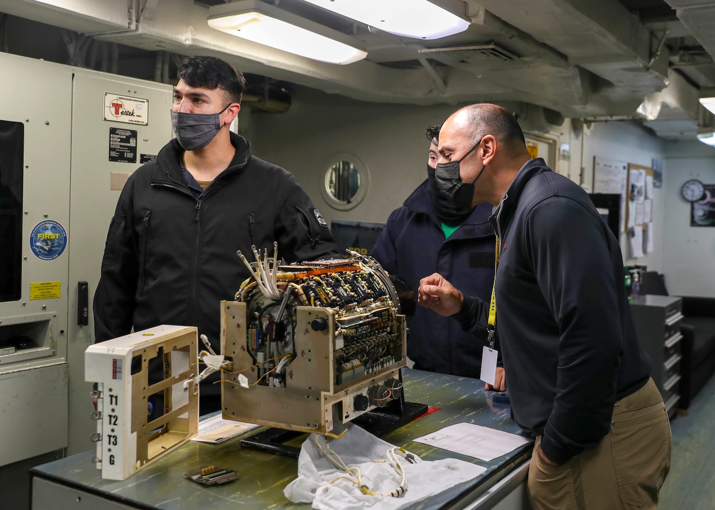 Rep. Jimmy Panetta (right), from California’s 20th Congressional District, views an F/A-18 Super Hornet generator control unit aboard the aircraft carrier USS Abraham Lincoln (CVN 72).