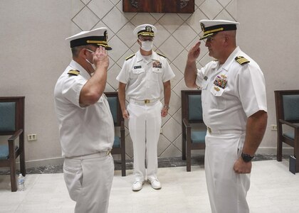 Captain Gustavo Vergara and Captain Brian Karosich salute during Forward Deployed Regional Maintenance Center’s (FDRMC) Change of Command at Naval Support Activity Naples Chapel, August 30, 2021. Karosich assumed command of FDRMC during the ceremony.