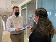 Reese Osborne, the plans and operations action officer at Logistics Readiness Center-Benelux, 405th Army Field Support Brigade, provides a 405th AFSB’s Commander’s Forum back brief to Diana Ioane, plans and operations chief at LRC-Benelux.