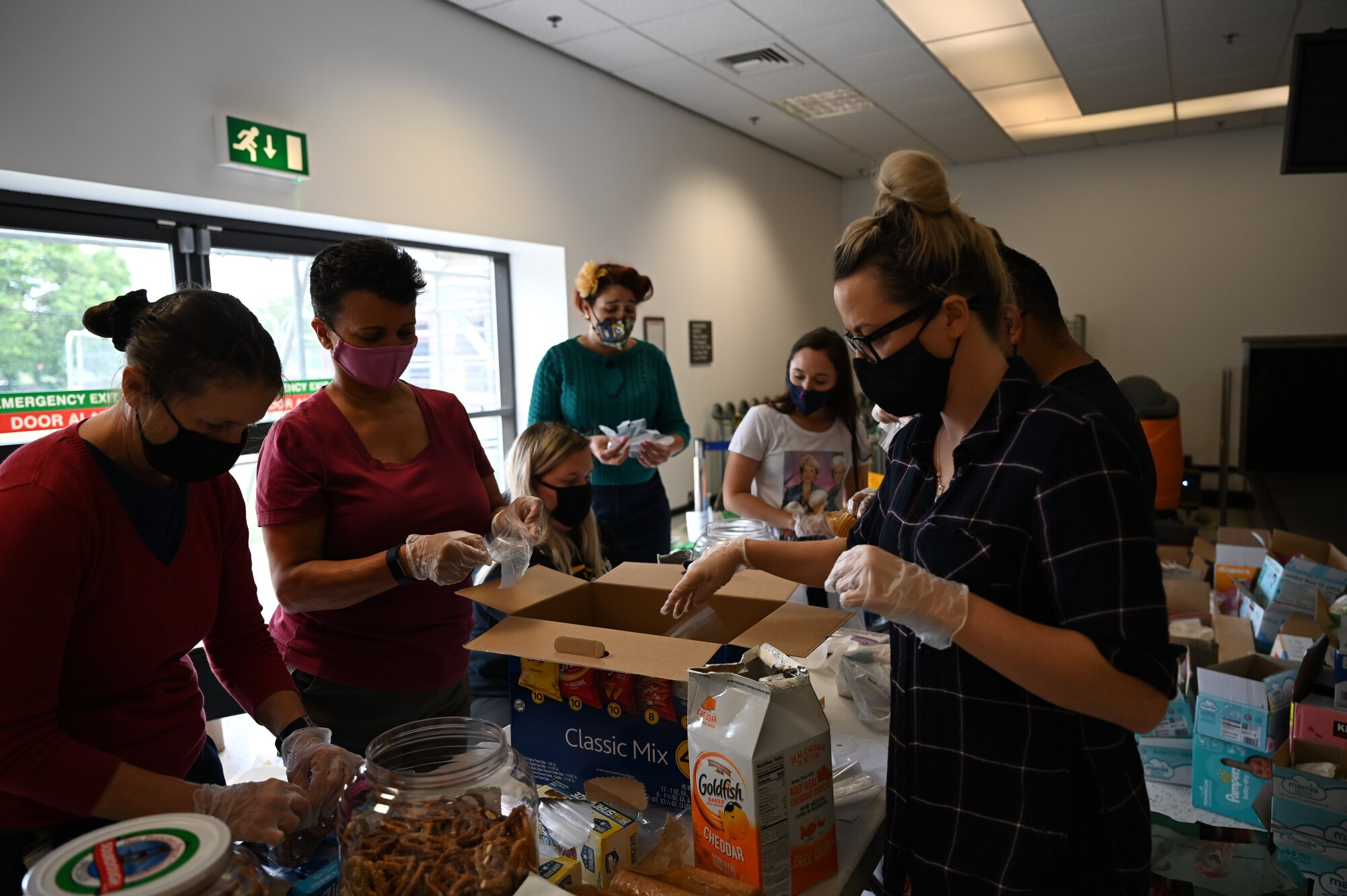 U.S. Airmen, civilians and military spouses from Team Mildenhall and Royal Air Force Lakenheath volunteer in support of Operation Allies Refuge at RAF Mildenhall, England, Aug. 26, 2021.