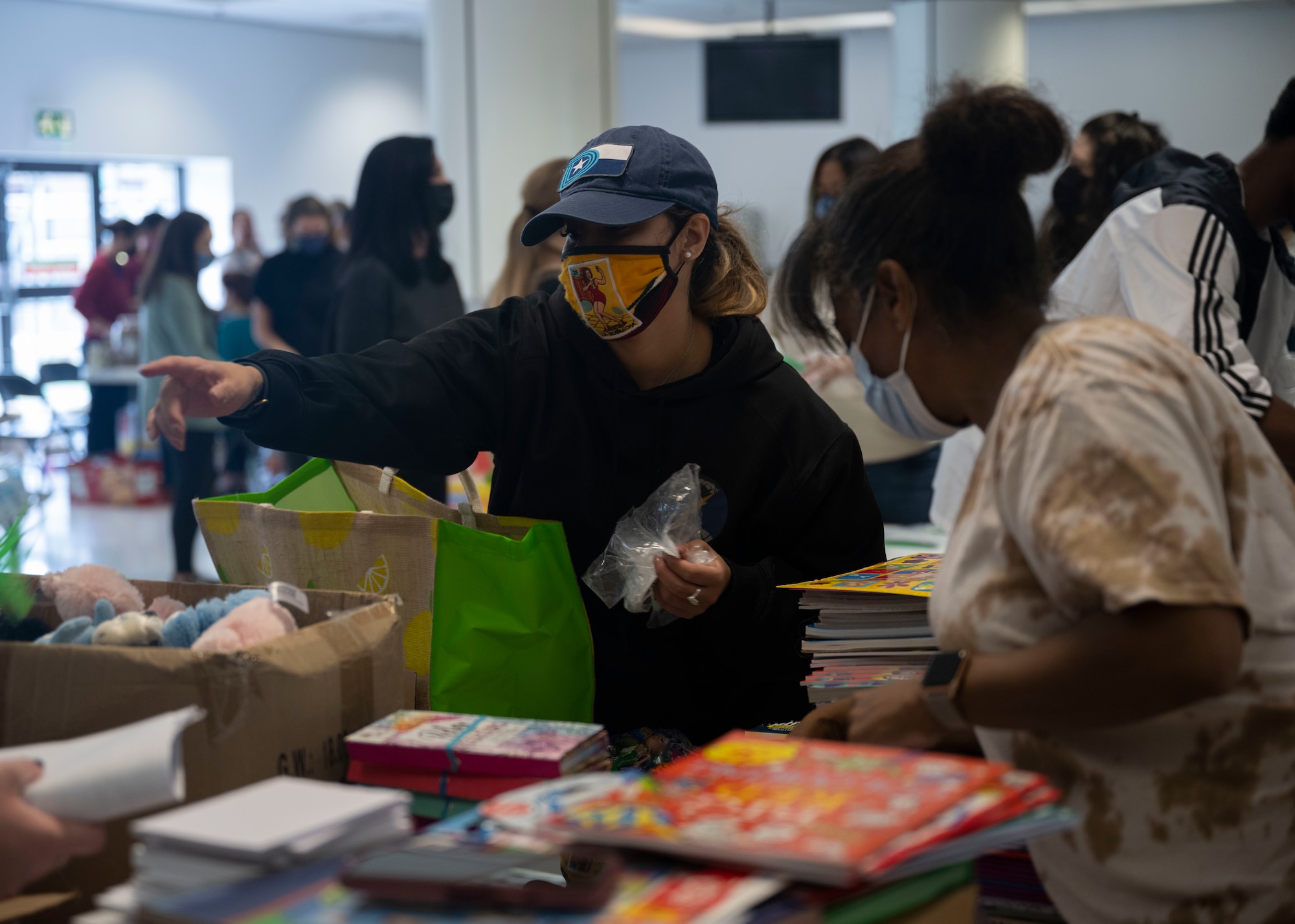U.S. Airmen, civilians and military spouses from Team Mildenhall and Liberty Wing volunteer  in support of Operation Allies Refuge at Royal Air Force Mildenhall, England, Aug. 26, 2021.