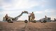 A weapons load crew team from the 2nd Aircraft Maintenance Squadron transfer a Mk-62 Quickstrike naval mine in support of a training exercise at Barksdale Air Force Base, Louisiana, Aug. 25, 2021. The 2nd AMXS is proficiently trained in the loading of naval mines, as well as conventional and nuclear weapons. (U.S. Air Force photo by Senior Airman Jacob B. Wrightsman)