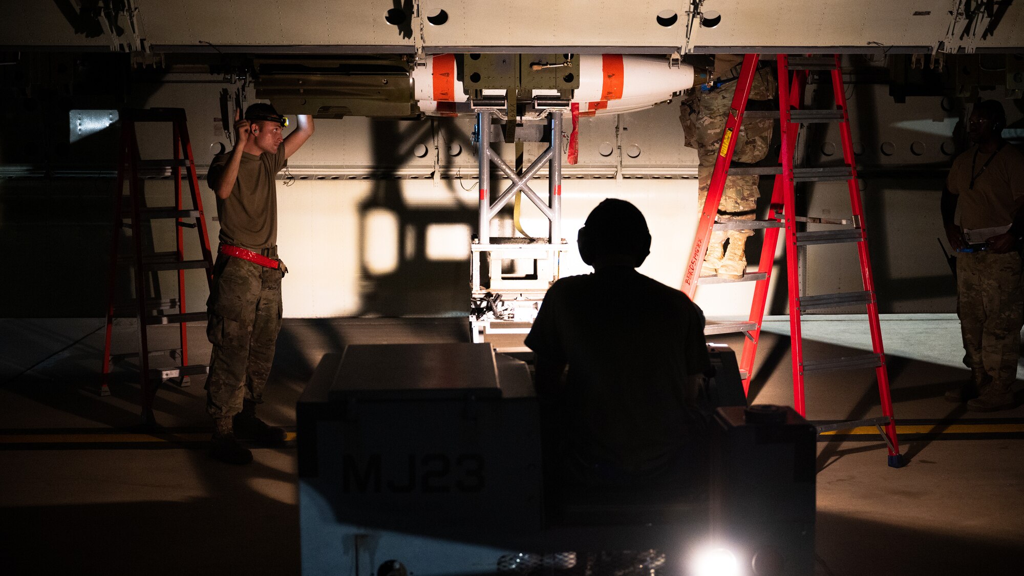 A weapons load crew team from the 2nd Aircraft Maintenance Squadron load a Mk-62 Quickstrike naval mine onto a B-52H Stratofortress in support of a training exercise at Barksdale Air Force Base, Louisiana, Aug. 25, 2021. The B-52 has the ability to carry and employ naval mines, as well as conventional and nuclear weapons. (U.S. Air Force photo by Senior Airman Jacob B. Wrightsman)
