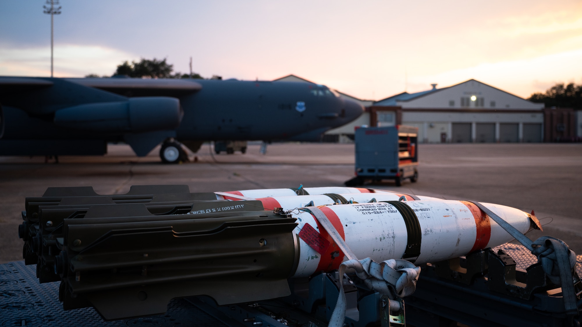 MK-62 Quickstrike naval mines sit in front of a B-52H Stratofortress at Barksdale Air Force Base, Louisiana, Aug. 25, 2021. The B-52 has the ability to carry and employ naval mines, as well as conventional and nuclear weapons. (U.S. Air Force photo by Senior Airman Jacob B. Wrightsman)