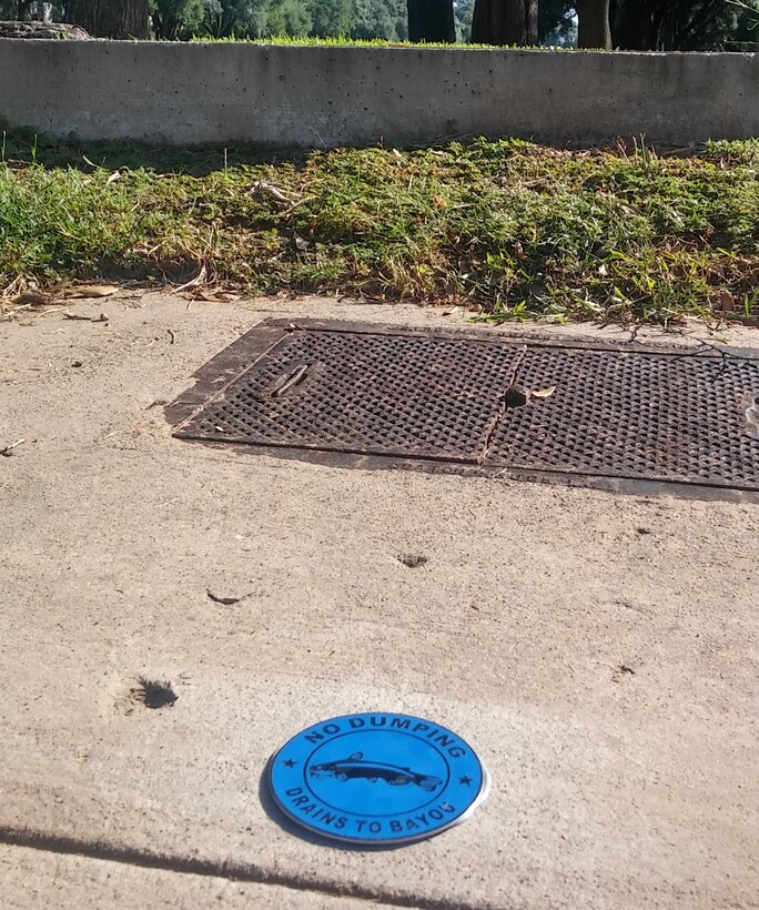 Base housing storm drain medallion – picture taken by 2CES Environmental, 2016. (Courtesy Photo)