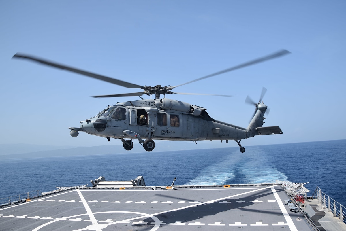 An MH-60S Sea Hawk helicopter takes off from the flight deck of the Spearhead-class expeditionary fast transport ship USNS Burlington (T-EPF 10) after refueling, Aug. 28, 2021.